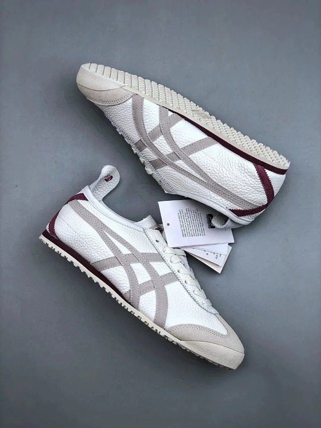 Onitsuka Tiger Mexico 66 sneakers in beige and burgundy with white laces and classic design, displayed on a neutral background.