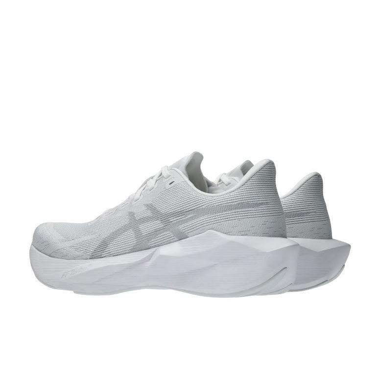 White ASICS NOVABLAST 6 running shoes with breathable mesh upper and cushioned sole, designed for comfort and support.
