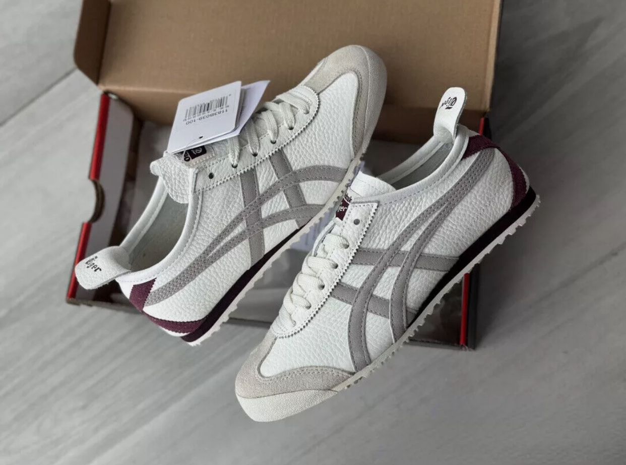 Onitsuka Tiger Mexico 66 sneakers in beige and burgundy with white laces and classic design, styled for casual wear.