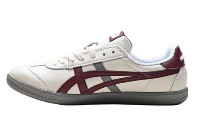 Onitsuka Tiger Tokuten sneakers in white, burgundy, and grey with a classic design, displayed on a neutral background.