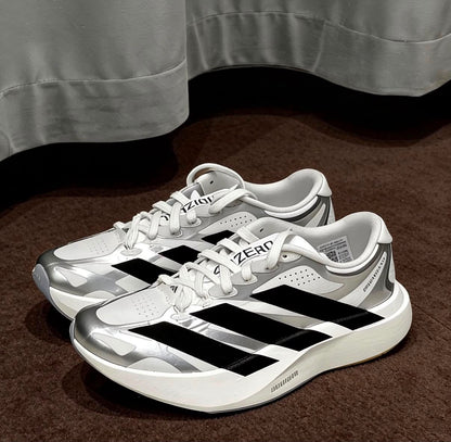 White, black, and silver adidas Adizero EVO SL EXO running shoes with sleek design and breathable mesh uppers.