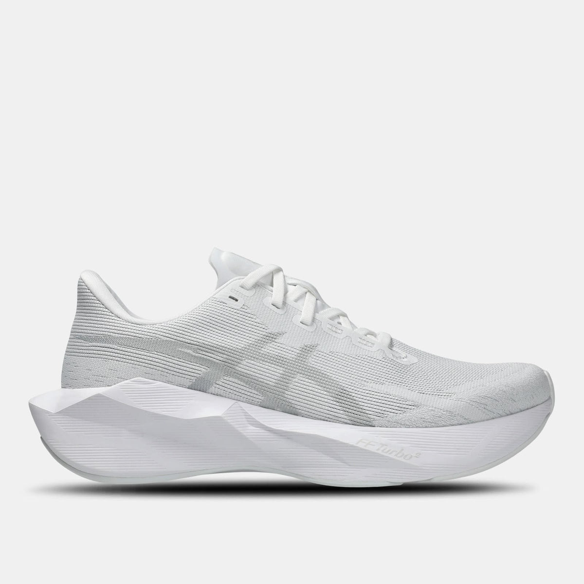 White ASICS NOVABLAST 6 running shoes with foam midsole and mesh upper, featuring ASICS branding and lightweight design.