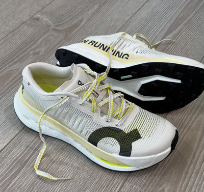 On Cloudultra Pro Pearl and Lychee running shoes by Orixa Kicks, featuring a sleek design with white and pastel pink accents.