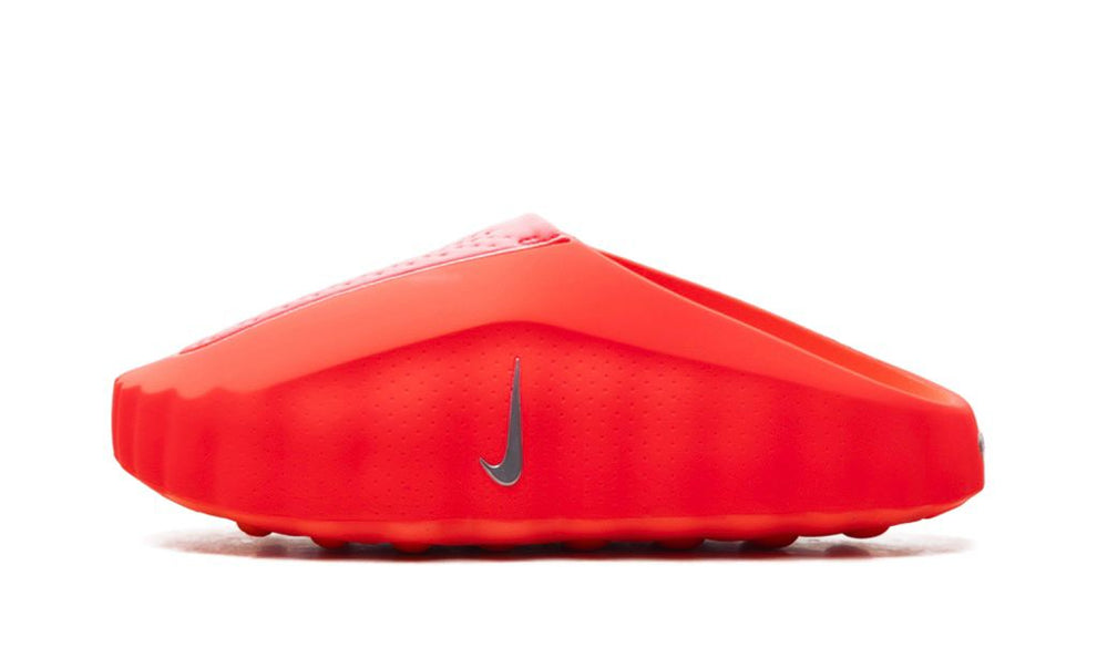 Nike Mind 001 Solar Red sneakers in a vibrant red color, featuring sleek design and Nike branding, displayed on a plain background.