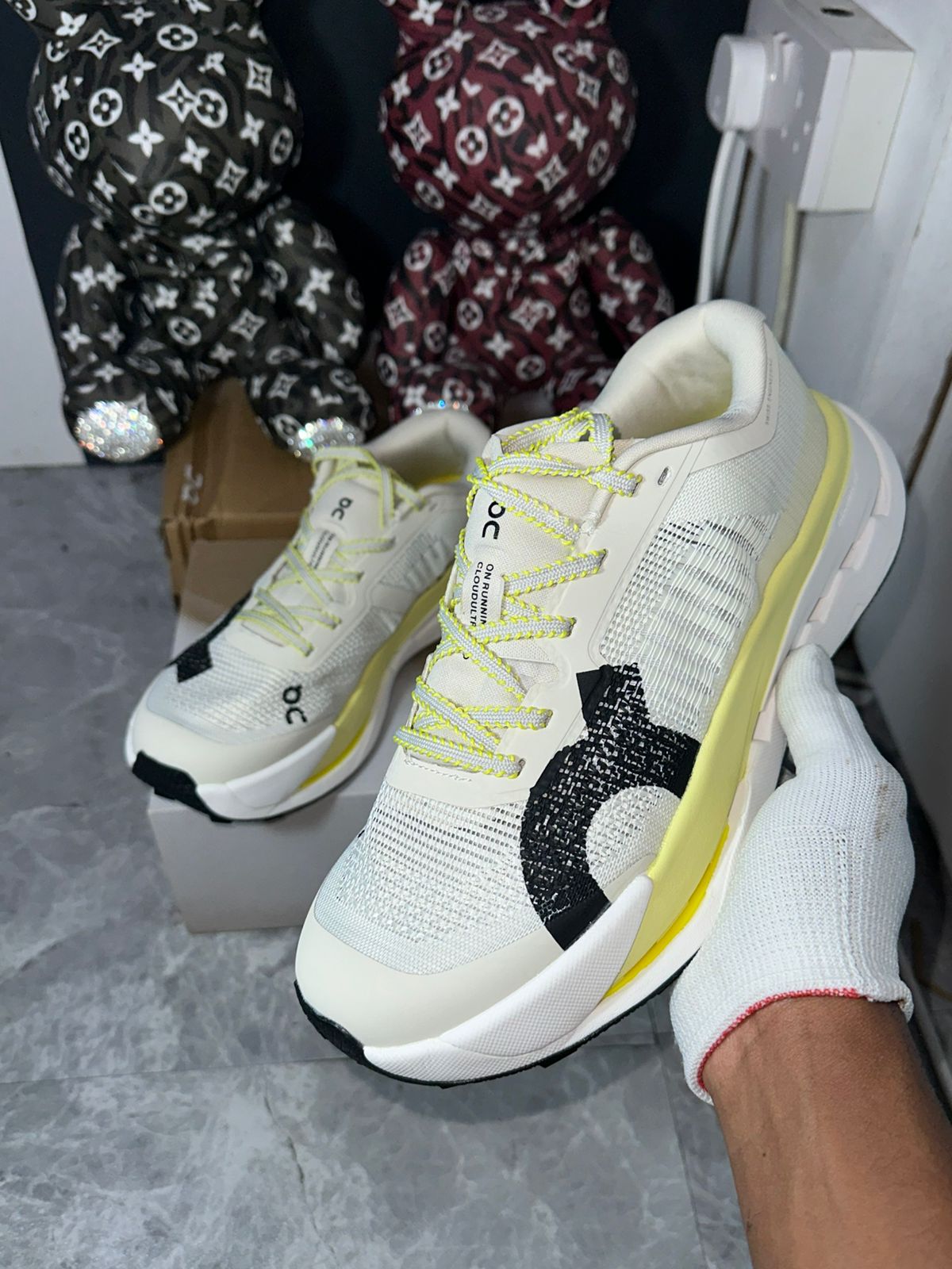 On Cloudultra Pro 'Pearl | Lychee' running shoes by Orixa Kicks, featuring a sleek design with white and pink accents.