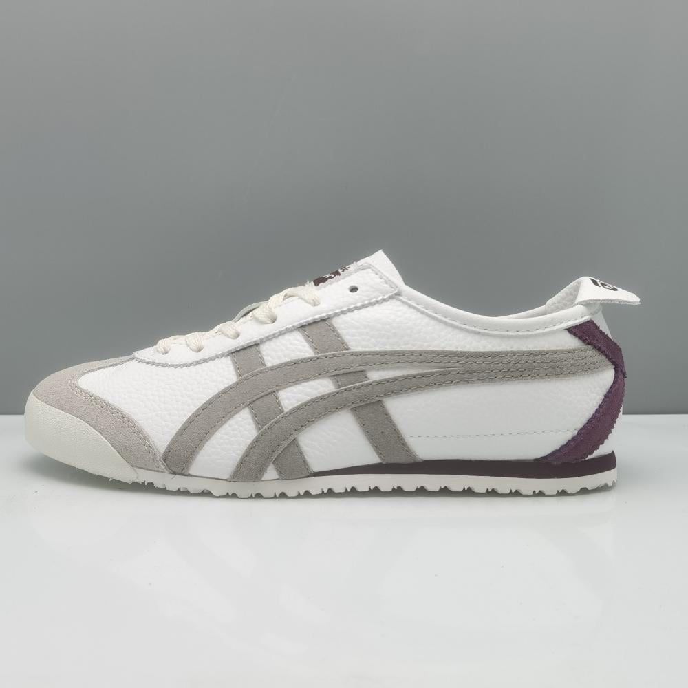 Onitsuka Tiger Mexico 66 sneakers in beige and burgundy with white laces and classic design, displayed on a neutral background.