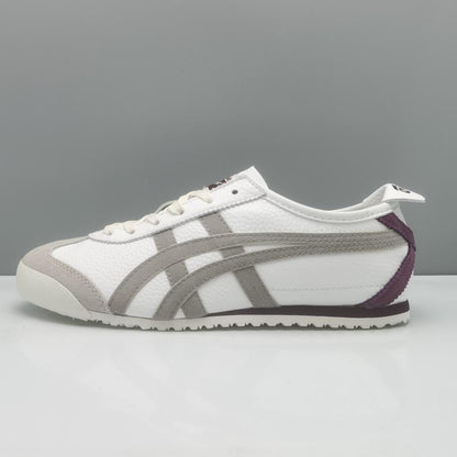 Onitsuka Tiger Mexico 66 sneakers in beige and burgundy with white laces and classic design, displayed on a neutral background.