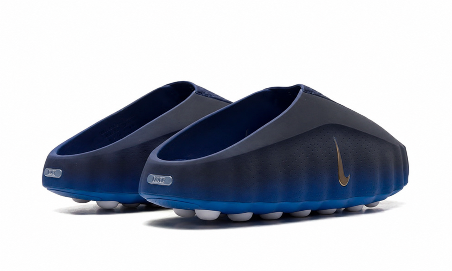Nike Mind 001 Slide in blackened blue color with cushioned sole and strap, featuring the Nike logo on the strap.