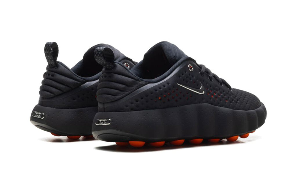 Nike Mind 002 "Black Chrome" sneaker by UAE Kicks featuring sleek black and chrome design, modern athletic shoe style.