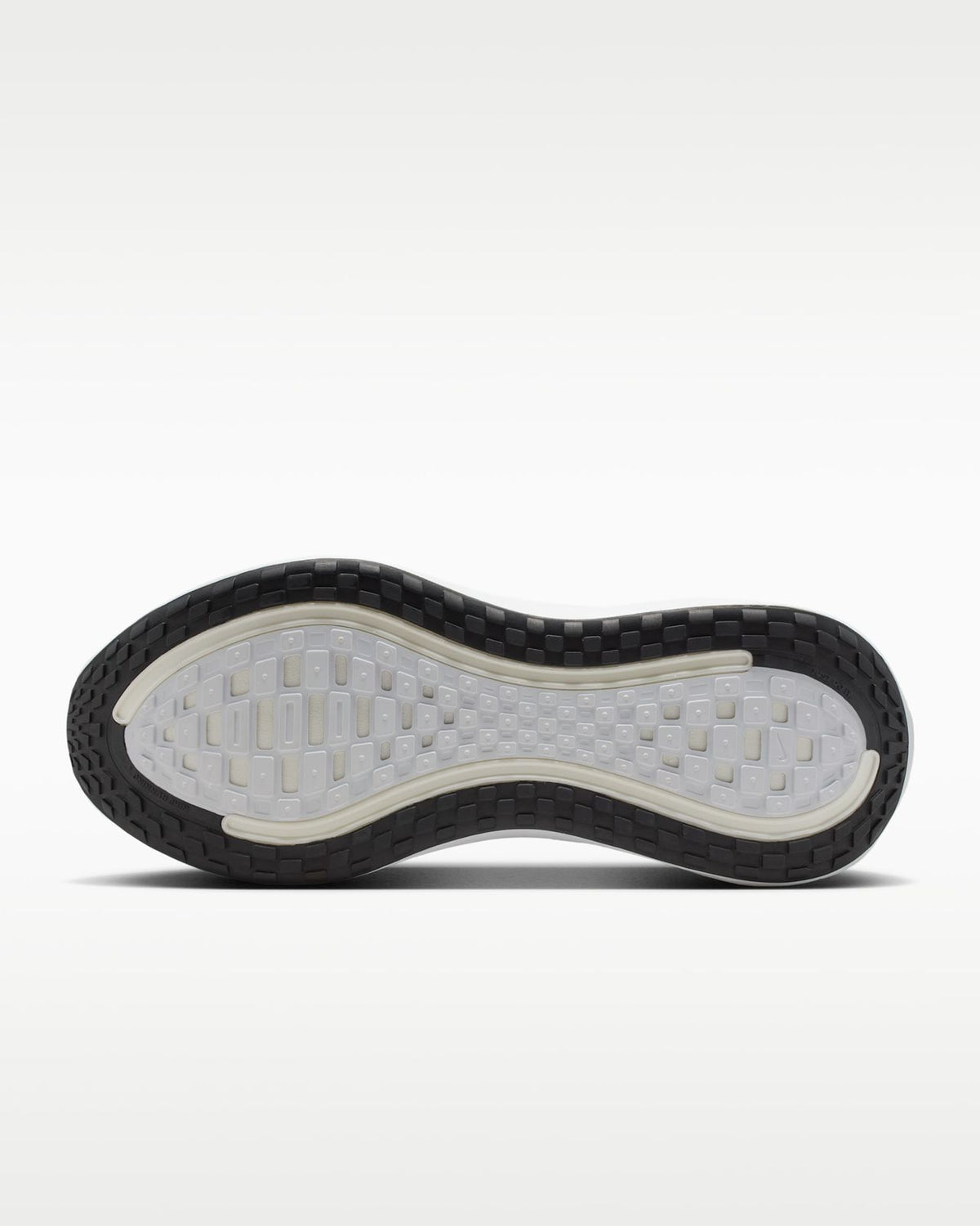 White Nike Vomero Plus running shoes by Orixa Kicks, showing the sleek design and breathable mesh upper