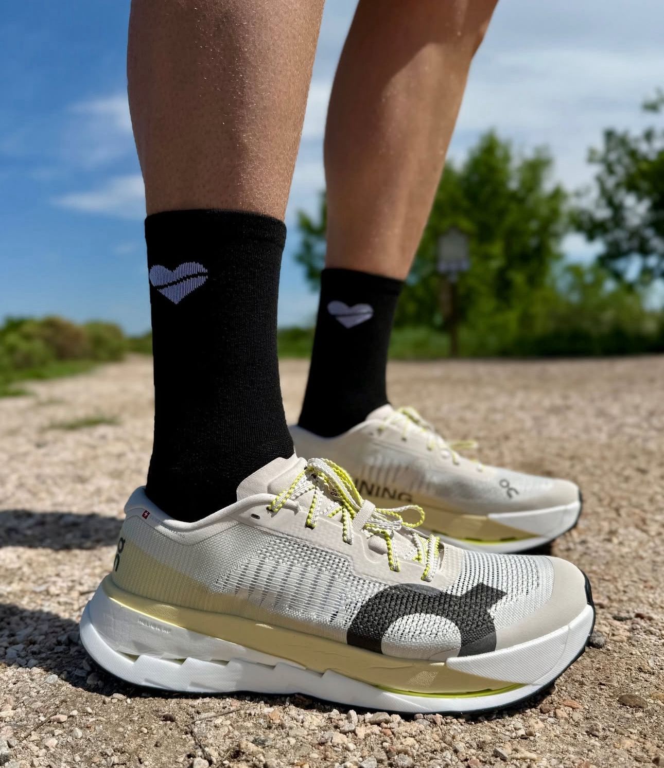 On Cloudultra Pro running shoes by Orixa Kicks in Pearl and Lychee colorway, featuring a sleek design and cushioned sole.