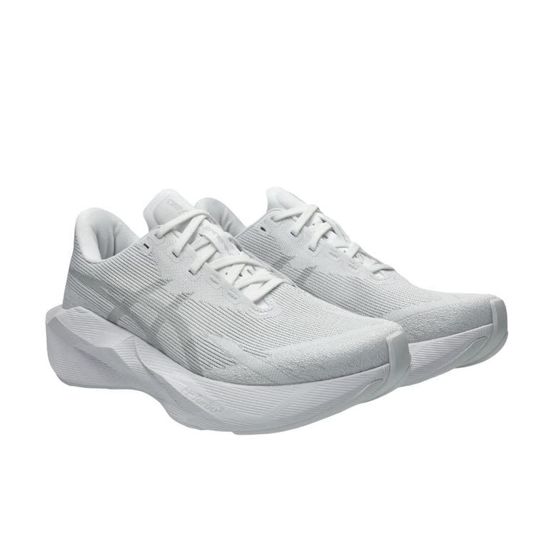 White ASICS NOVABLAST 6 running shoes with breathable mesh upper and cushioned sole, designed for comfort and performance.