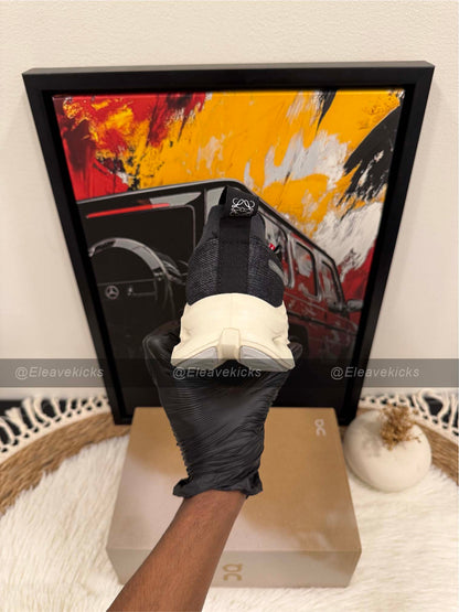 On Cloudtilt sneaker in black and asphalt.